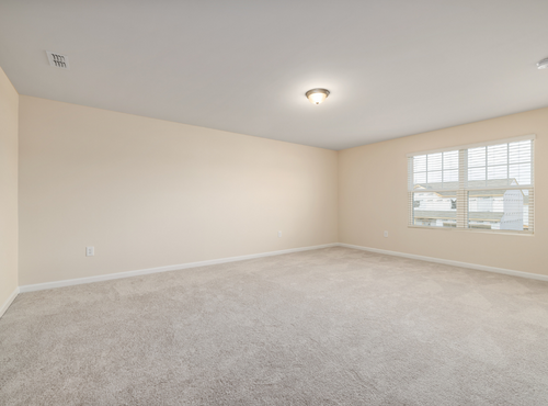 This is a photo of an empty room with cream carpets works carried out by Clerkenwell Carpet Cleaning